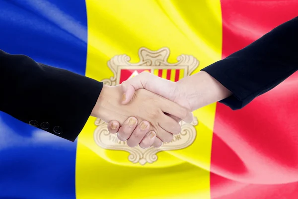 Handdruk met Andorrese vlag op de achtergrond — Stockfoto