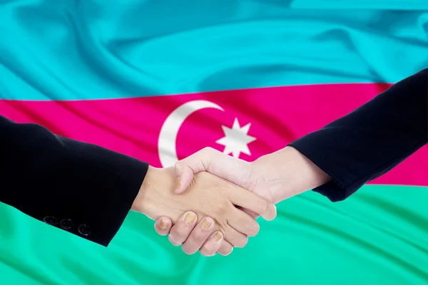 Poignée de main avec drapeau de azerbaijan — Photo