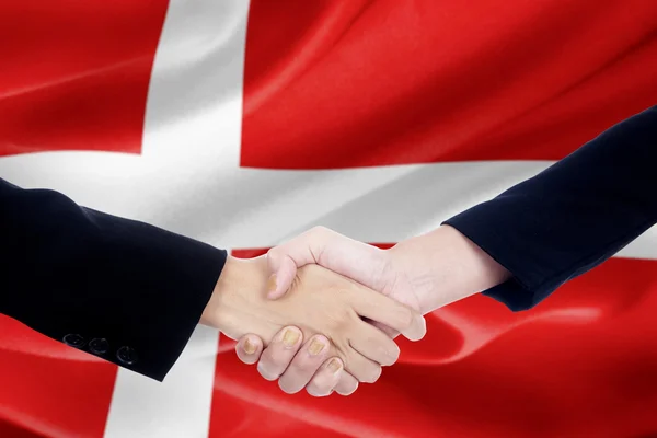 Handshake with flag of Denmark — Stock Photo, Image