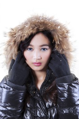 Lovely face of asian girl in winter clothing