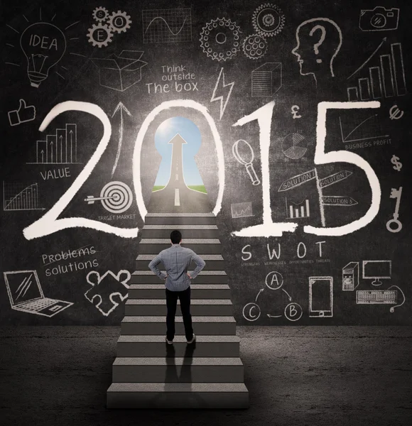 Man entering a success door in 2015 — 스톡 사진