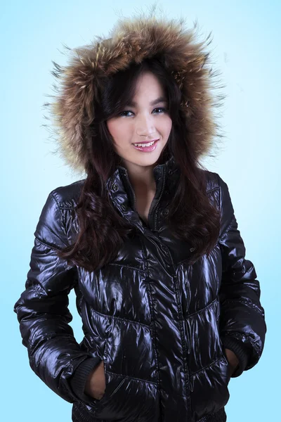 Teenage girl in winter jacket with fur cap — Stock Photo, Image