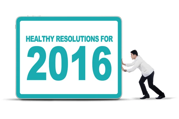 Physician pushing healthy resolutions for 2016 — Stock Photo, Image