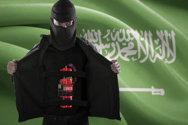 Terrorist met vlag van Saoedi-Arabië en tijdbom — Stockfoto