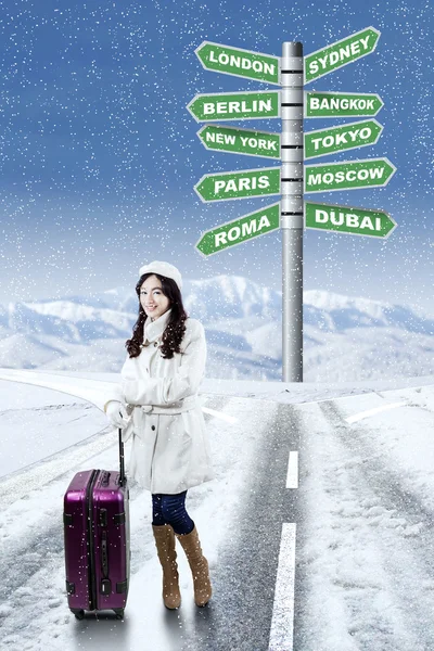 Girl with destination choices for holiday — Stock Photo, Image