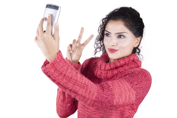 Indian woman with sweater and taking selfie photo — Stock Photo, Image