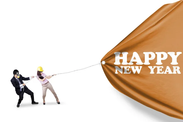 Young people and the banner new year — Stock Photo, Image