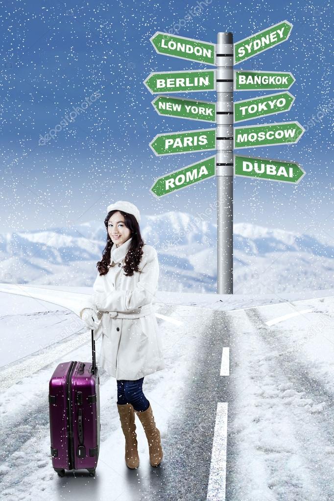 Girl with destination choices for holiday