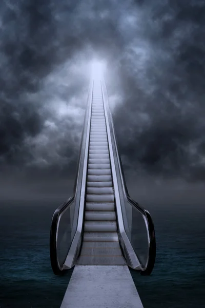 Empty escalator under clouds — Stock Photo, Image