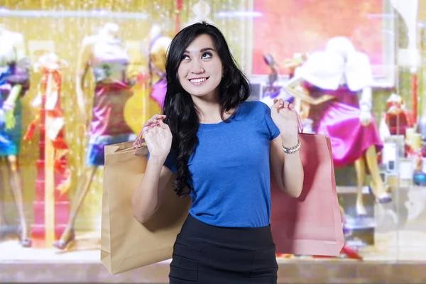 Joyful woman enjoy shopping at mall — Stock Photo, Image