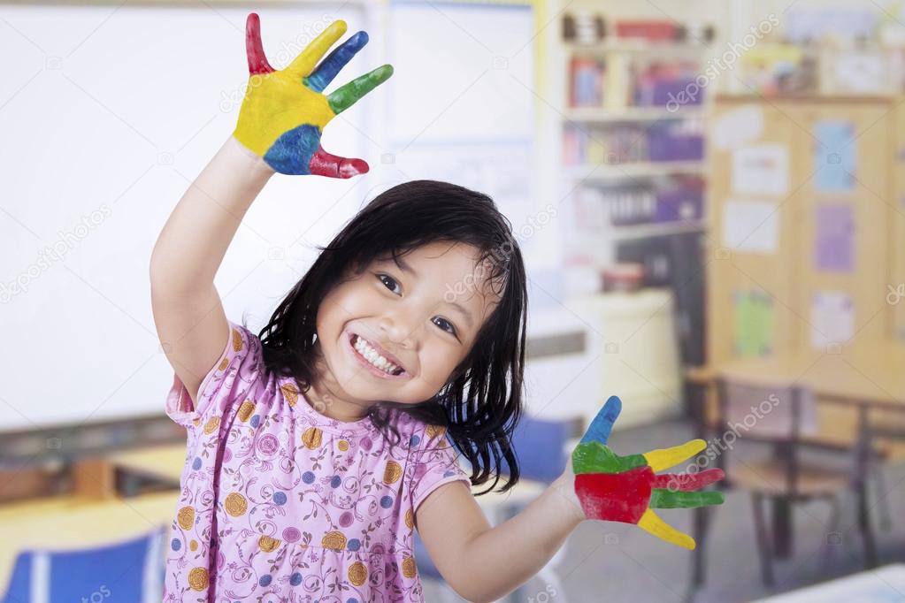 Smiling Girl with Painted Hands