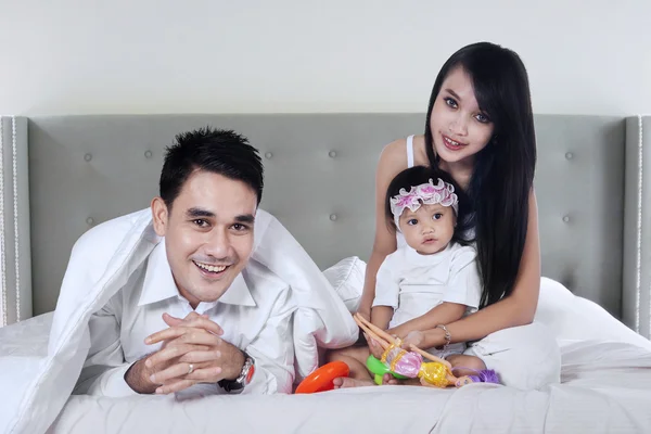 Family playing toys in bedroom — Stock Photo, Image