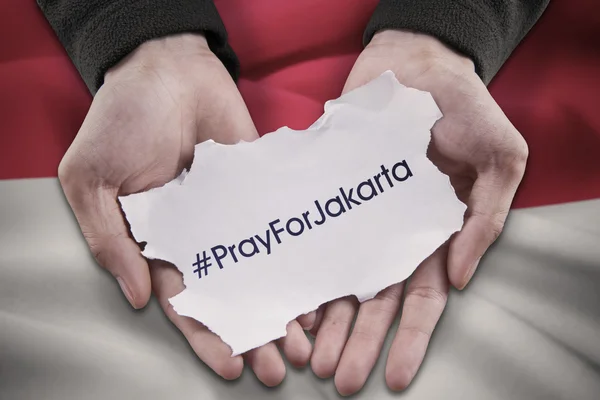 Ruce drží text modlit pro Jakarta — Stock fotografie