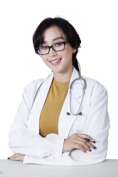 Pretty young doctor smiling at the camera — Stock Photo, Image