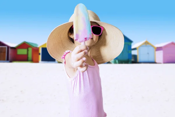 Child offering ice cream on the camera — Stock Photo, Image