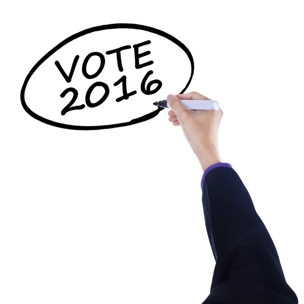 Особа пише текст голосування 2016 року — стокове фото