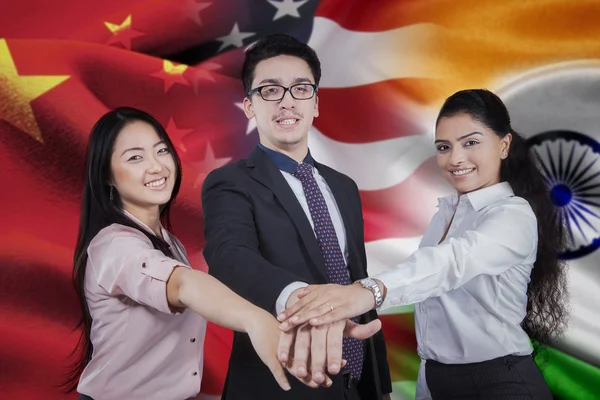 Workers with flag of chinese, american, and indian