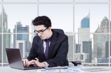Busy middle eastern entrepreneur working in office