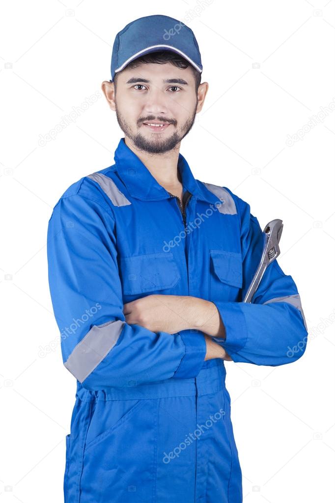 Handsome male mechanic in studio