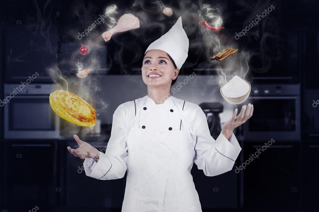 Professional chef cooking with magic Stock Photo by ©realinemedia 98371884