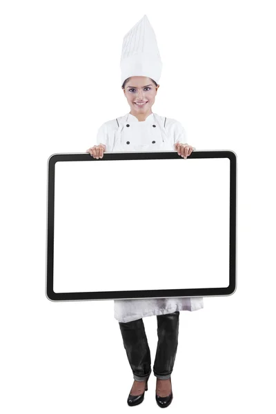 Chef holding empty board in studio — Stock Photo, Image