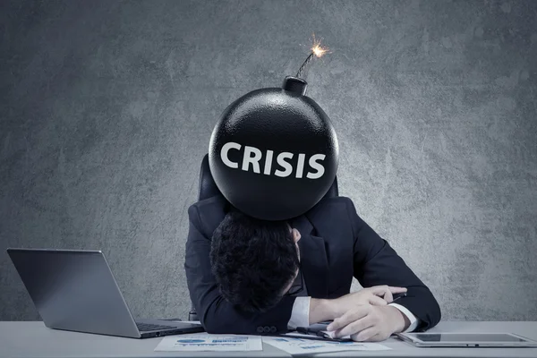 Entrepreneur with bomb of financial crisis — Stock Photo, Image