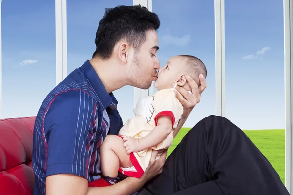 Man kiss his child near the window — Stock Photo, Image