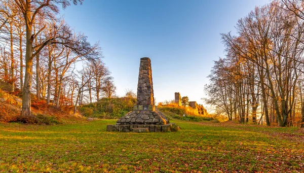 Ruin of castle Zubstejn standing on hill, Czech Republic. Castle built in 13 th century. Autumn day during the sunset. One of biggest ruins in Czechia. Also known as Zuberstein or Zubstein.