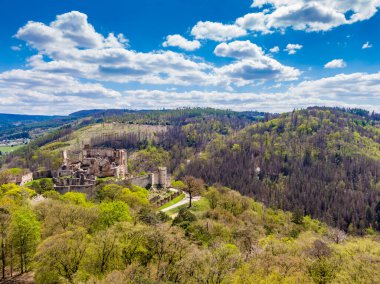 Aerial drone panorama view of medieval castle Boskovice. Ruin of ancient stronghold placed at hill in South Moravia region, Czech Republic. Summer day with blue sky.
