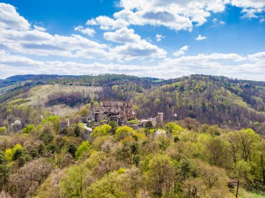 Aerial drone panorama view of medieval castle Boskovice. Ruin of ancient stronghold placed at hill in South Moravia region, Czech Republic. Summer day with blue sky.