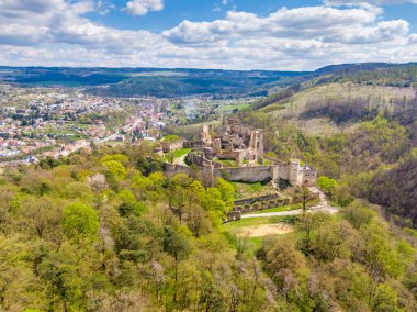 Aerial drone panorama view of medieval castle Boskovice. Ruin of ancient stronghold placed at hill in South Moravia region, Czech Republic. Summer day with blue sky.