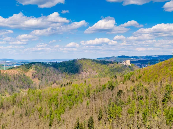 Aerial drone panorama view of medieval castle Boskovice. Ruin of ancient stronghold placed at hill in South Moravia region, Czech Republic. Summer day with blue sky.