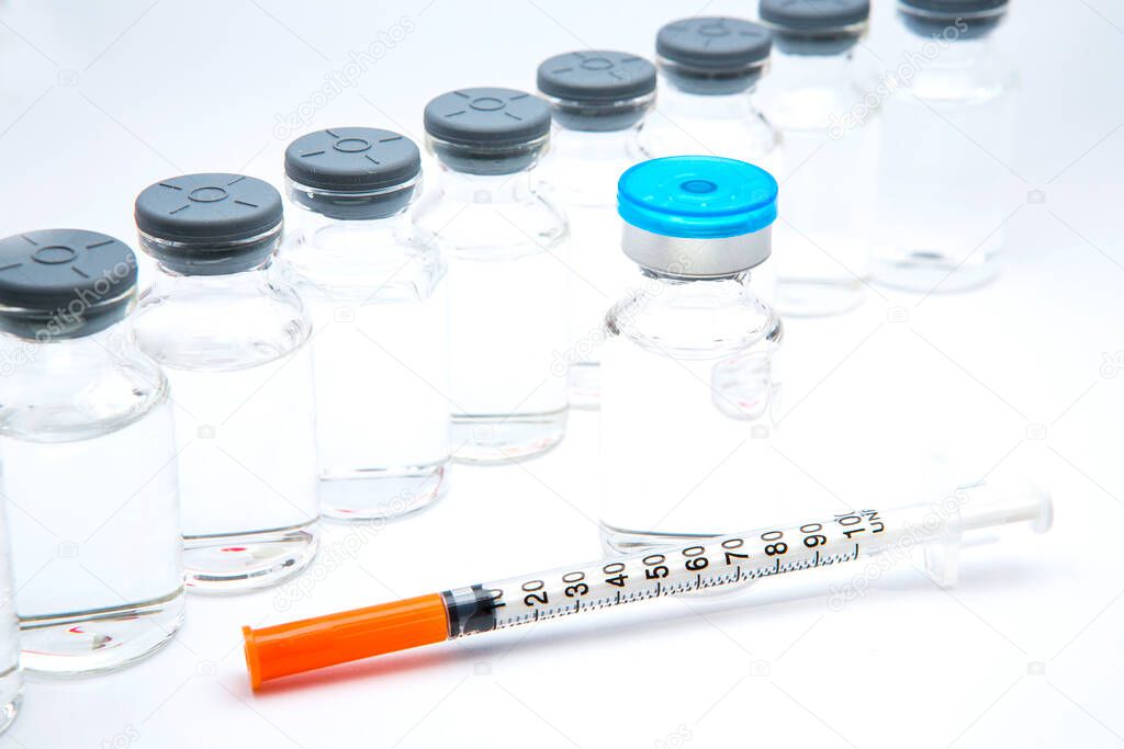 a bottle of vaccine on a white background