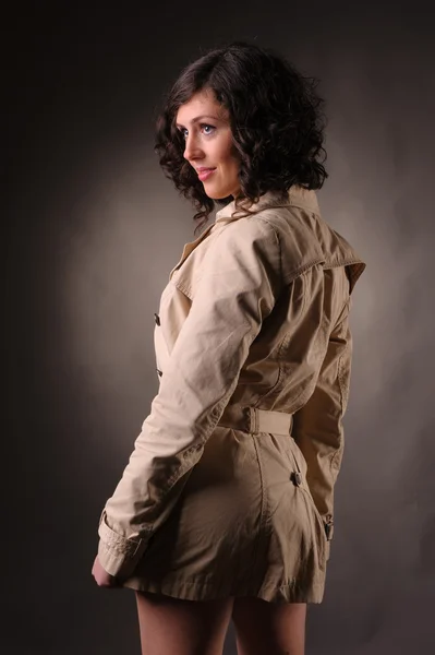 Beautiful woman wearing a raincoat — Stock Photo, Image