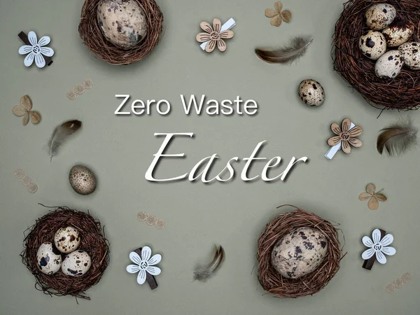 Easter, zero waste concept. Quail eggs in nests, feathers and easter decoration made from natural material. Overhead view with text: Zero Waste Easter