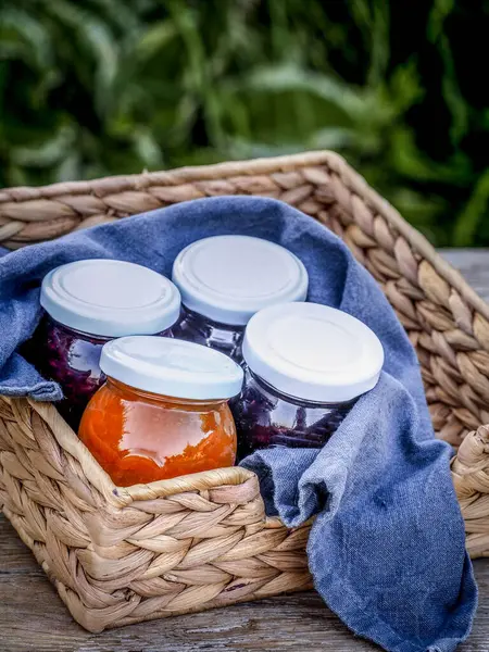 Basket Four Jars Homemade Jam Blackberries Strawberries Apricots Table Garden — Stock Photo, Image