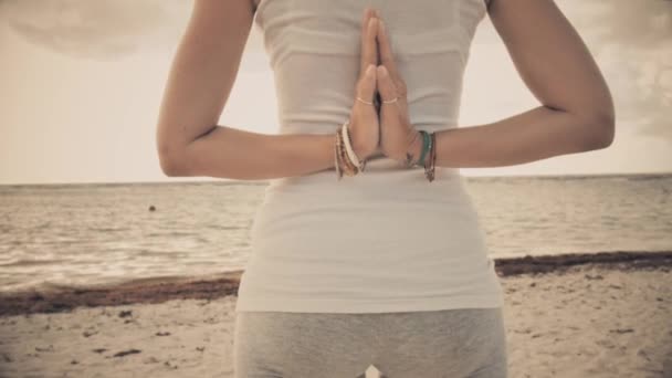 Woman in reverse prayer yoga pose — Stock Video