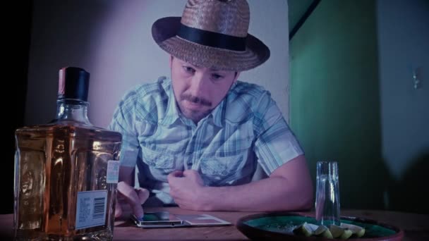 Man using his smartphone in a bar — Stock Video