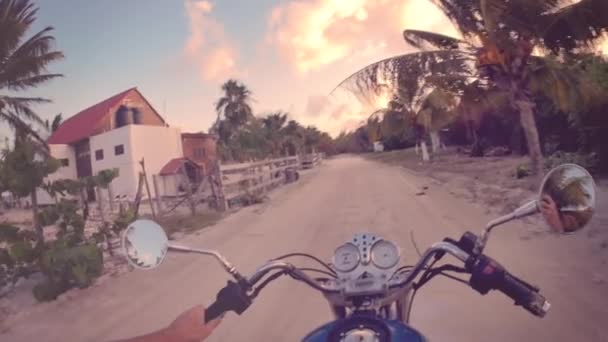 Ridding motorcycle in the caribbean — Stock Video