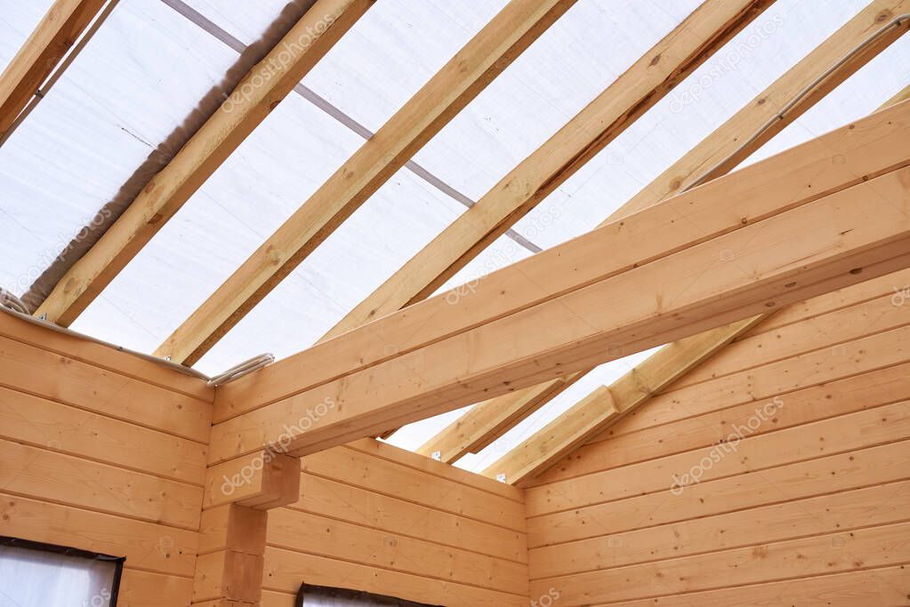 inside a wooden house under construction, no people.