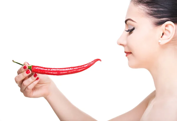 Girl with red pepper in her hand Stock Photo