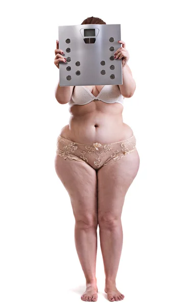 Fat woman with bathroom scales — Stock Photo, Image