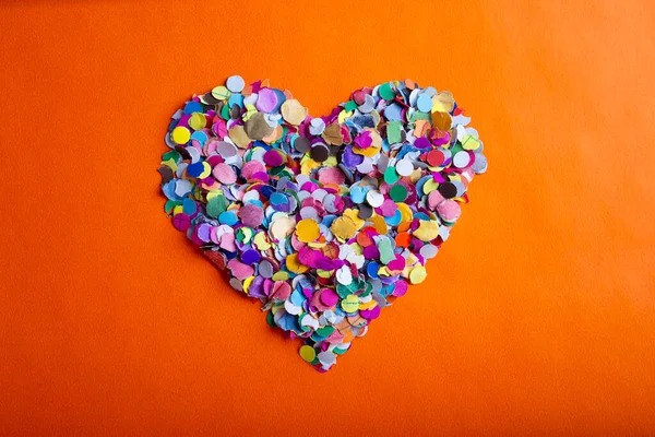 Love Concept Image Heart Shape Made Colorful Confetti Orange Papier — Zdjęcie stockowe