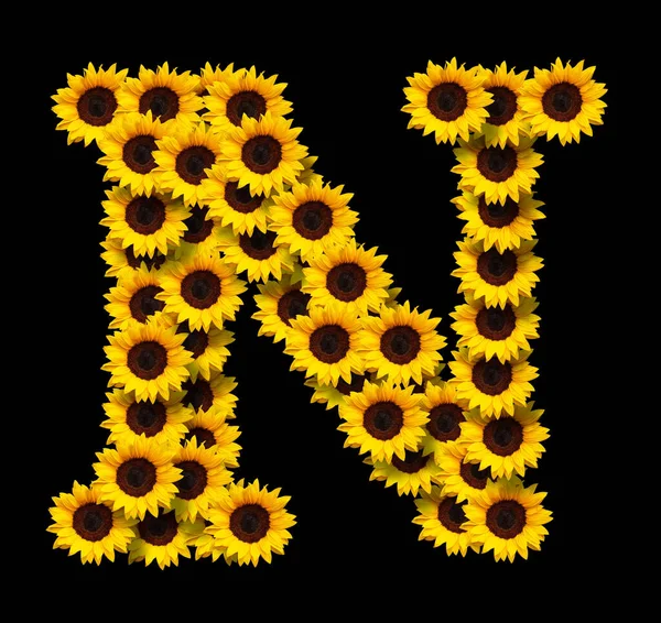 Großbuchstabe Aus Gelben Sonnenblumen Blüten Isoliert Auf Schwarzem Hintergrund Gestaltungselement — Stockfoto