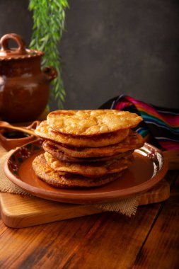 Mexican Bunuelos. Traditionally fried wheat tortillas used for Christmas and winter holidays, these are fried flour tortillas sprinkled with sugar or covered in a syrup made with piloncillo, cinnamon, and guava.
