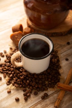 Cafe de olla, a traditional spiced Mexican black coffee, the recipe varies by region, with cinnamon, brown sugar, or piloncillo, and some recipes include cloves and star anise.