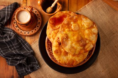 Mexican Bunuelos. Traditionally fried wheat tortillas used for Christmas and winter holidays, these are fried flour tortillas sprinkled with sugar or covered in a syrup made with piloncillo, cinnamon, and guava.