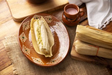 Tamales. Traditional food typical of Mexico and some Latin American countries. Corn dough wrapped in corn leaves. The tamales are steamed.