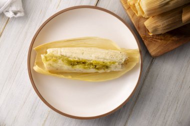 Tamales. Traditional food typical of Mexico and some Latin American countries. Corn dough wrapped in corn leaves. The tamales are steamed.