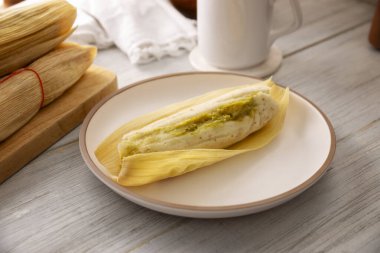 Tamales. Traditional food typical of Mexico and some Latin American countries. Corn dough wrapped in corn leaves. The tamales are steamed.